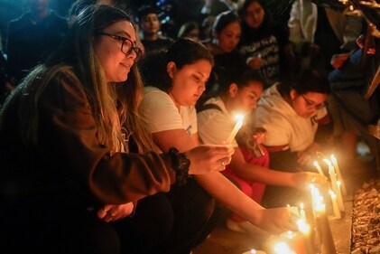 Fans light candles outside the hotel where former One Direction singer Liam Payne was found dead after he fell from a balcony in Buenos Aires, Argentina, Wednesday, Oct. 16, 2024. (AP Photo/Natacha Pisarenko) (AP)