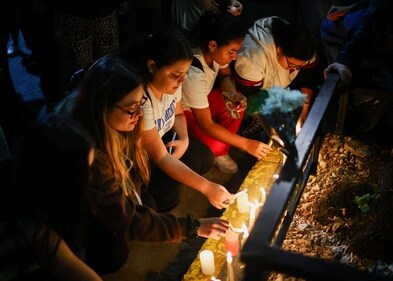 Fans place candles outside the hotel where Liam Payne, former One Direction member, was found dead, in Buenos Aires, Argentina, October 16, 2024. (REUTERS)