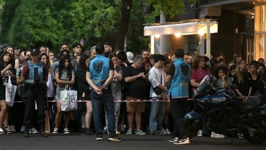 Fans of British singer Liam Payne wait near the hotel where he died in Buenos Aires on October 16, 2024. British singer Liam Payne, former member of the group One Direction, died Wednesday aged 31 after falling from the third floor of a hotel in Argentina, police in Buenos Aires said.(AFP)