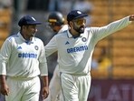India's captain Rohit Sharma (R) talks to his teammate Sarfaraz Khan during the third day of the first Test cricket match between India and New Zealand India's captain Rohit Sharma (R) talks to his teammate Sarfaraz Khan during the third day of the first Test cricket match between India and New Zealand