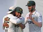 Pakistan's Aamer Jamal celebrates with teammates Babar Azam (C) and Shaheen Shah Afridi (R) Pakistan's Aamer Jamal celebrates with teammates Babar Azam (C) and Shaheen Shah Afridi (R)