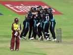 New Zealand players celebrate after winning the match