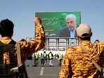 Yemeni soldiers shout slogans in front of a billboard showing Hamas leader Yahya Sinwar during an anti-Israel rally in Sanaa, Yemen, Friday, Oct. 18, 2024. Arabic reads, "martyr Yahya Sinwar".