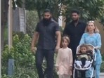 Karolina Goswami walks with security in India.