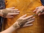 Karwa Chauth 2024: Transform the Karwa Chauth mehndi session into a themed party. (Shutterstock)