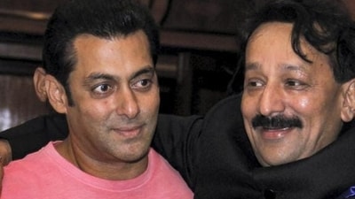 In this July 21, 2013 file photo, then Congress leader Baba Siddique with actor Salman Khan during an Iftar party in Mumbai. Three unidentified persons fired at and injured Baba Siddiqui of the Ajit Pawar-led NCP in Mumbai's Bandra East on Saturday evening. In this July 21, 2013 file photo, then Congress leader Baba Siddique with actor Salman Khan during an Iftar party in Mumbai. Three unidentified persons fired at and injured Baba Siddiqui of the Ajit Pawar-led NCP in Mumbai's Bandra East on Saturday evening.
