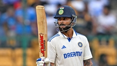 India's Virat Kohli celebrates after scoring a half-century (50 runs) during the third day of the first Test cricket match between India and New Zealand (AFP) India's Virat Kohli celebrates after scoring a half-century (50 runs) during the third day of the first Test cricket match between India and New Zealand (AFP)