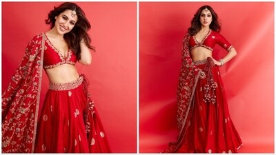 Sara Ali Khan's red lehenga set is the perfect blend of tradition and charm. It features a V-neckline blouse paired with a matching skirt. She completes the look with a stunning golden embroidered dupatta.&nbsp; (Instagram/@saraalikhan)