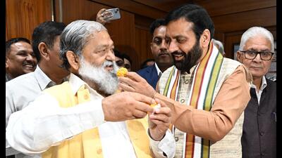 Haryana CM Nayab Saini with cabinet minister Anil Vij at the Civil Secretariat in Chandigarh on Friday. (HT photo)