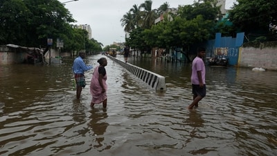 People wade through a flooded street after heavy rains in Chennai, India, Wednesday, Oct. 16, 2024. (AP Photo/Mahesh Kumar A.) (AP) People wade through a flooded street after heavy rains in Chennai, India, Wednesday, Oct. 16, 2024. (AP Photo/Mahesh Kumar A.) (AP)
