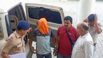 Police personnel and others after arresting Sukha alias Sukhbir Balbir Singh, a member of the Lawrence Bishnoi gang and an accused in an alleged plot to kill Bollywood actor Salman Khan. (PTI)