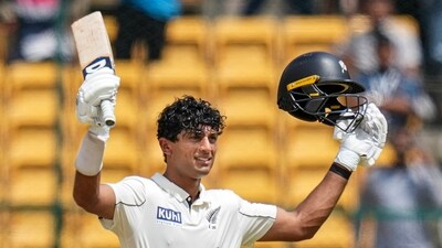 New Zealand's batter Rachin Ravindra celebrates his century during the third day of the first Test cricket match against India (PTI) New Zealand's batter Rachin Ravindra celebrates his century during the third day of the first Test cricket match against India (PTI)