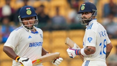 India's Virat Kohli and Sarfaraz Khan run between the wickets on the third day of the first Test vs New Zealand (PTI) India's Virat Kohli and Sarfaraz Khan run between the wickets on the third day of the first Test vs New Zealand (PTI)