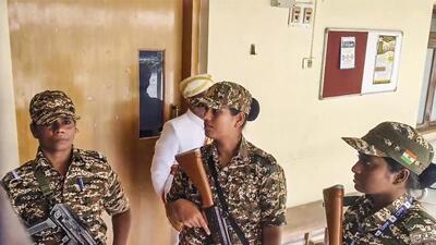 Security personnel stand guard during a raid by the Enforcement Directorate on the Mysuru Urban Development Authority (MUDA) office in connection with a money laundering case in Mysuru on Friday. (PTI) Security personnel stand guard during a raid by the Enforcement Directorate on the Mysuru Urban Development Authority (MUDA) office in connection with a money laundering case in Mysuru on Friday. (PTI)
