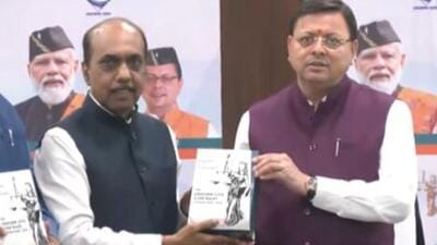 The nine-member government appointed committee headed by former chief secretary Shatrughna Singh handed over the document to Dhami at the secretariat (Screengrab) The nine-member government appointed committee headed by former chief secretary Shatrughna Singh handed over the document to Dhami at the secretariat (Screengrab)