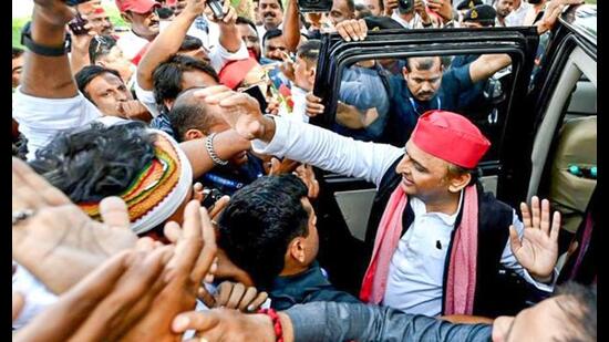 Samajwadi Party chief Akhilesh Yadav being welcomed by party workers as he arrives to address a public meeting in Malegaon, at Nashik airport on Friday. (ANI Photo)
