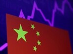 FILE PHOTO: A Chinese flag and a stock graph are seen in this illustration picture taken April 30, 2024. REUTERS/Dado Ruvic/Illustration/File Photo