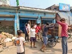 Locals vacate their shops after public works department (PWD) pasted notices on the properties of several people asking them to remove any illegal construction and warning of action, in violence-hit Maharajganj area of Bahraich, UP (PTI)