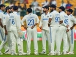 India's captain Rohit Sharma and others on the ground after bad light stopped play on the fourth day of the first test cricket match between India and New Zealand India's captain Rohit Sharma and others on the ground after bad light stopped play on the fourth day of the first test cricket match between India and New Zealand
