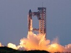 SpaceX's recent test flight showcased its progress in rocket reusability, achieving booster catch while preparing for ambitious missions to the Moon and Mars.