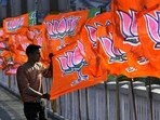 A worker erecting BJP flags in Jammu.
