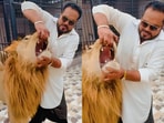 Man sparked outrage for prying open a lion's jaws in viral Instagram video.






