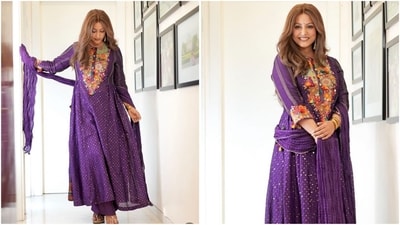 Hina Khan's fashion game is on point as she stuns in an ethnic purple anarkali suit adorned with multicoloured floral embroidery. Paired with a matching dupatta and statement earrings, she exudes elegance. (Instagram) Hina Khan's fashion game is on point as she stuns in an ethnic purple anarkali suit adorned with multicoloured floral embroidery. Paired with a matching dupatta and statement earrings, she exudes elegance. (Instagram)