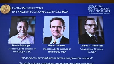 The Nobel memorial prize in economics awarded to Daron Acemoglu, Simon Johnson and James A Robinson, seen on screen, during a press meeting at the Royal Swedish Academy of Sciences in Stockholm, Sweden, Monday Oct. 14, 2024. (Christine Olsson/TT News Agency via AP/PTI) (AP) The Nobel memorial prize in economics awarded to Daron Acemoglu, Simon Johnson and James A Robinson, seen on screen, during a press meeting at the Royal Swedish Academy of Sciences in Stockholm, Sweden, Monday Oct. 14, 2024. (Christine Olsson/TT News Agency via AP/PTI) (AP)