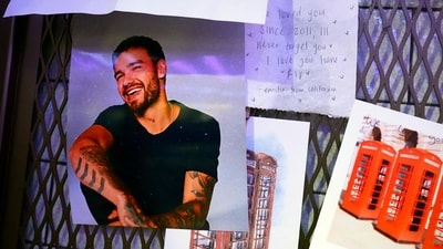 Tributes for Liam Payne are seen next to the phonebox in the Hard Rock Cafe in Piccadilly Circus in London, which was used on a One Direction album cover, on Friday Oct. 18, 2024. (AP) Tributes for Liam Payne are seen next to the phonebox in the Hard Rock Cafe in Piccadilly Circus in London, which was used on a One Direction album cover, on Friday Oct. 18, 2024. (AP)