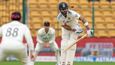 India's Virat Kohli plays a shot he is caught by New Zealand's Glenn Philips during the day two of the first cricket test match between India and New Zealand (AP) India's Virat Kohli plays a shot he is caught by New Zealand's Glenn Philips during the day two of the first cricket test match between India and New Zealand (AP)
