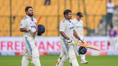 India's Sarfaraz Khan and Rishabh Pant walk off the field as rain stops play during the fourth day of the first Test. (PTI) India's Sarfaraz Khan and Rishabh Pant walk off the field as rain stops play during the fourth day of the first Test. (PTI)