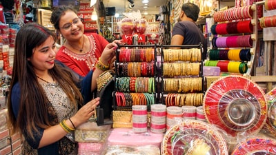 Women purchase bangles from a shop ahead of the Karwa Chauth festival in Dehradun on Friday. According to the Purnimanta calendar, Karwa Chauth falls on Krishna Paksha Chaturthi in the Hindu month of Kartik. Karwa Chauth is celebrated on the same day throughout India. (PTI) Women purchase bangles from a shop ahead of the Karwa Chauth festival in Dehradun on Friday. According to the Purnimanta calendar, Karwa Chauth falls on Krishna Paksha Chaturthi in the Hindu month of Kartik. Karwa Chauth is celebrated on the same day throughout India. (PTI)