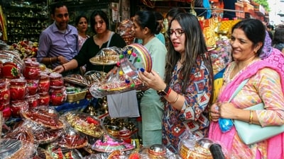 Women shop at a market for the Karwa Chauth festival in Dehradun. Women observe an arduous nirjala vrat (sans water fast) during the festival from dawn to moonrise for their husband's long lives and prosperity. Women only eat food or drink water after making offering to the moon. (PTI) Women shop at a market for the Karwa Chauth festival in Dehradun. Women observe an arduous nirjala vrat (sans water fast) during the festival from dawn to moonrise for their husband's long lives and prosperity. Women only eat food or drink water after making offering to the moon. (PTI)