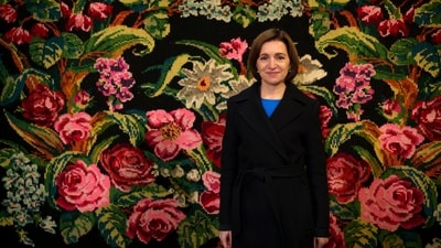 Moldova's President Maia Sandu waits while posing for photographs with supporters in Magdacesti, Moldova, Thursday, Oct. 17, 2024, as she seeks a second term in office ahead of a presidential election and a referendum of whether to enshrine in Moldova's Constitution its path to European Union membership taking place on Oct.20. (AP Photo/Vadim Ghirda) (AP)
