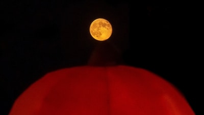 Supermoons occur when the Moon is at its closest point to Earth, making it appear larger and brighter than usual—up to 15% brighter and 30% bigger than typical full moons. (Robert Cohen/St. Louis Post-Dispatch via AP)