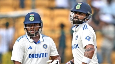 Virat Kohli and Sarfaraz Khan during the third day’s play of the first Test at the M. Chinnaswamy Stadium in Bengaluru. (AFP) (HT_PRINT) Virat Kohli and Sarfaraz Khan during the third day’s play of the first Test at the M. Chinnaswamy Stadium in Bengaluru. (AFP) (HT_PRINT)