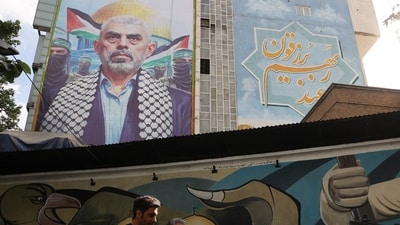 A billboard with a picture of the late Hamas leader Yahya Sinwar is displayed on a building in Tehran, Iran. (Reuters)