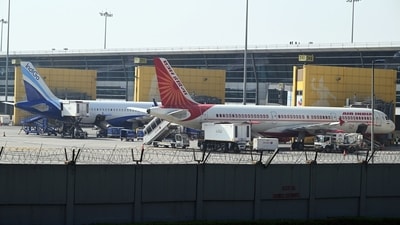 IndiGo and an Air India aircrafts on the tarmac at Indira Gandhi International Airport in New Delhi. (Bloomberg)