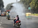 An anti-smog vehicle sprinkles water to curb air pollution amid deteriorating air quality, in New Delhi on Saturday. An anti-smog vehicle sprinkles water to curb air pollution amid deteriorating air quality, in New Delhi on Saturday.