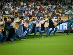 Groundsmen cover the field as it rains during the fourth day play of the first Test cricket match between India and New Zealand at the M. Chinnaswamy Stadium in Bengaluru on October 19, 2024. Groundsmen cover the field as it rains during the fourth day play of the first Test cricket match between India and New Zealand at the M. Chinnaswamy Stadium in Bengaluru on October 19, 2024.