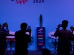 Media persons take photographs of Women's T20 Cricket World Cup trophy. Media persons take photographs of Women's T20 Cricket World Cup trophy.