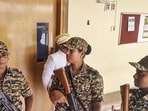 Security personnel stand guard during a raid by the Enforcement Directorate on the Mysuru Urban Development Authority (MUDA) office in connection with a money laundering case in Mysuru on Friday. (PTI) Security personnel stand guard during a raid by the Enforcement Directorate on the Mysuru Urban Development Authority (MUDA) office in connection with a money laundering case in Mysuru on Friday. (PTI)