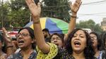 Women raise slogans near the site of junior doctors observing fast-unto-death in Kolkata on Sunday. (PTI)