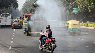 An anti-smog vehicle sprinkles water to curb air pollution amid deteriorating air quality, in New Delhi on Saturday. (ANI Photo/Amit Sharma) An anti-smog vehicle sprinkles water to curb air pollution amid deteriorating air quality, in New Delhi on Saturday. (ANI Photo/Amit Sharma)