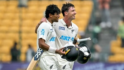 New Zealand's Will Young (R) and Rachin Ravindra celebrate their team's win against India at the end of their first Test cricket match in the M. Chinnaswamy Stadium. (AFP) New Zealand's Will Young (R) and Rachin Ravindra celebrate their team's win against India at the end of their first Test cricket match in the M. Chinnaswamy Stadium. (AFP)