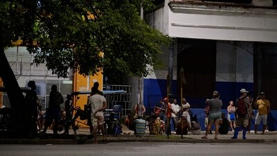 Cubans line up for bread during the second day of the nationwide blackout in Havana October 19, 2024. Hurricane Oscar is due to hit the island of Cuba imminently, with the risk of further affecting the population, who are spending their second night without electricity due to a giant blackout. (Photo by ADALBERTO ROQUE / AFP) (AFP) Cubans line up for bread during the second day of the nationwide blackout in Havana October 19, 2024. Hurricane Oscar is due to hit the island of Cuba imminently, with the risk of further affecting the population, who are spending their second night without electricity due to a giant blackout. (Photo by ADALBERTO ROQUE / AFP) (AFP)
