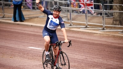 British cyclist Chris Hoy takes takes part in a parade during the Platinum Jubilee Pageant, marking the end of the celebrations for the Platinum Jubilee of Britain's Queen Elizabeth, in London, (REUTERS)