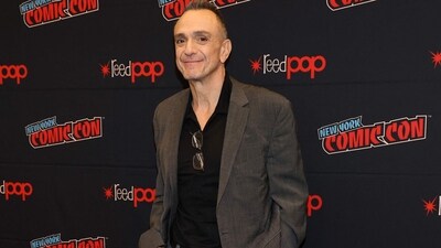 Hank Azaria attended The Simpsons panel during New York Comic Con at Jacob Javits Center on October 19 in New York City. He wore a black shirt under a jacket and trousers. (Getty Images via AFP) Hank Azaria attended The Simpsons panel during New York Comic Con at Jacob Javits Center on October 19 in New York City. He wore a black shirt under a jacket and trousers. (Getty Images via AFP)