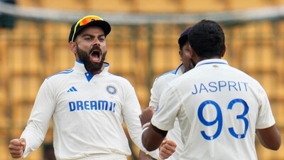 India's Jasprit Bumrah, right, celebrates with teammate Virat Kohli after the dismissal of New Zealand's captain Tom Latham during the day five of the first cricket test match between India and New Zealand at the M.Chinnaswamy Stadium, in Bengaluru, India, Sunday, Oct. 20, 2024. (AP Photo/Aijaz Rahi) (AP) India's Jasprit Bumrah, right, celebrates with teammate Virat Kohli after the dismissal of New Zealand's captain Tom Latham during the day five of the first cricket test match between India and New Zealand at the M.Chinnaswamy Stadium, in Bengaluru, India, Sunday, Oct. 20, 2024. (AP Photo/Aijaz Rahi) (AP)