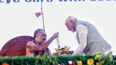Prime Minister Narendra Modi offers a fruit basket Jagadguru Shankaracharya Swami Vijayendra Saraswati during the inauguration of the RJ Sankara Eye Hospital, in Varanasi on Sunday. (ANI) Prime Minister Narendra Modi offers a fruit basket Jagadguru Shankaracharya Swami Vijayendra Saraswati during the inauguration of the RJ Sankara Eye Hospital, in Varanasi on Sunday. (ANI)